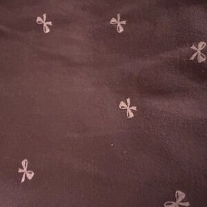 Plum Fabric with pink Bow Pattern